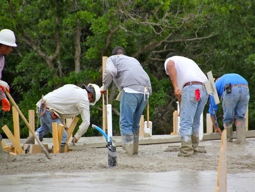 Guys Pouring Concrete
